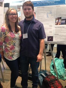 Axton and Megan presenting poster.