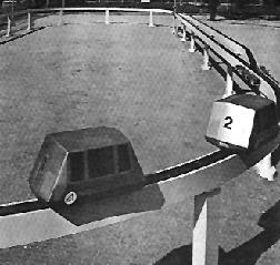 two vehicles on test track