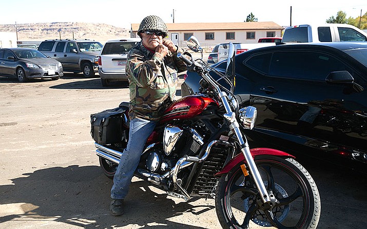This image is of a Native American veteran sitting atop his motorcycle.