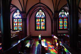 A room with stained glass windows

Description automatically generated with medium confidence