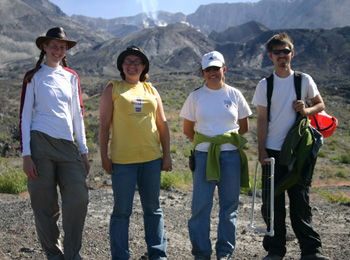 The team crew members, squinting into the sun by Mt. St. Helens