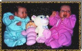 Allison and Laura play with a glow worm and a bear