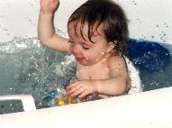 Laura splashing in the tub