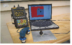 image of the scanner next to a laptop