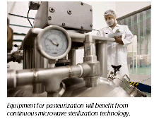 image of a man checking industrial equipment used for pasteurization