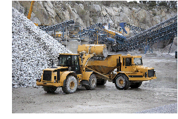 image of mining trucks in a rock mine