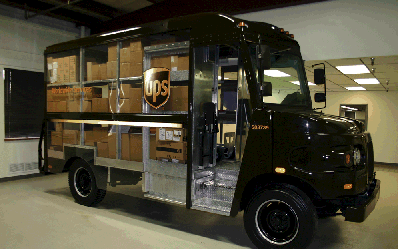 image of a brown UPS truck with a clear plastic side to see the packages inside