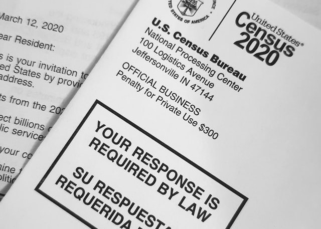 Printed U.S. census surveys saying “Your Response is Required by Law”