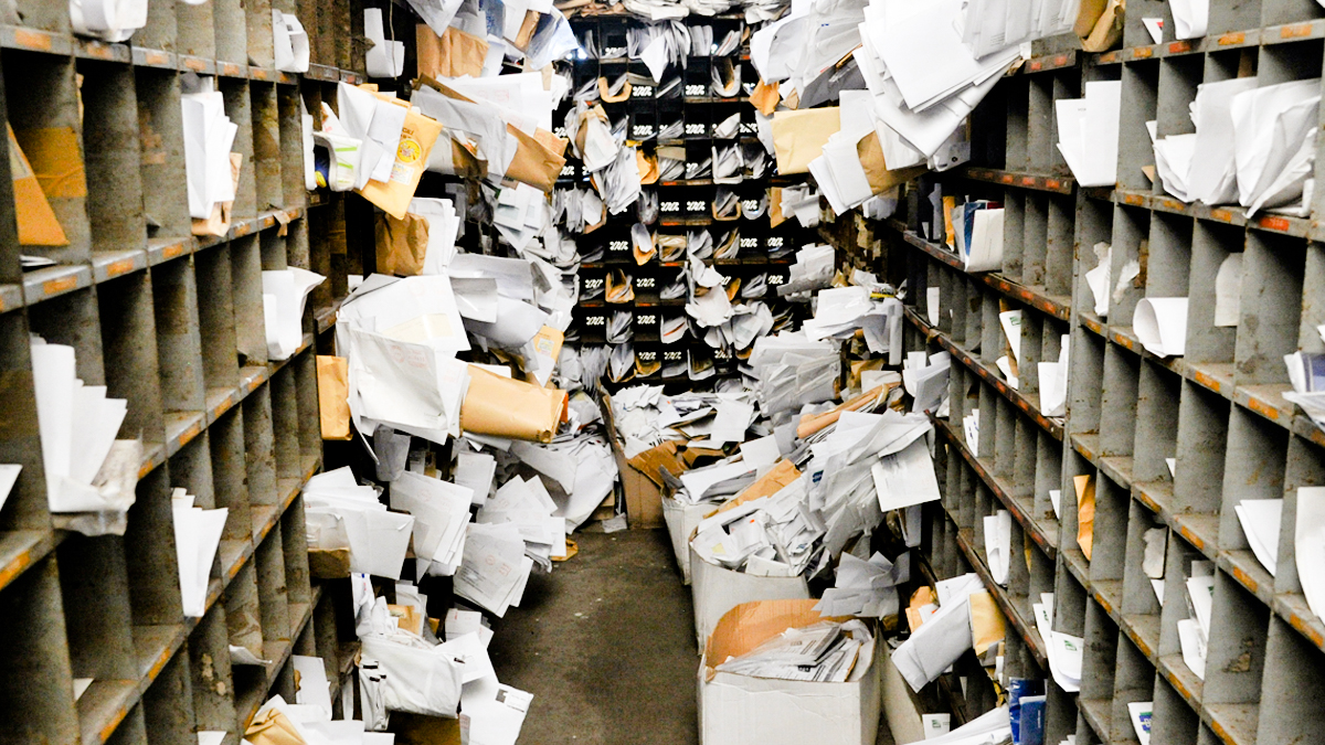 A photograph of an overfull mailroom.
