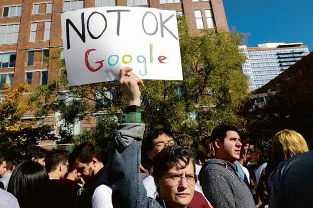 A photograph of a Google walkout, with a sign that says “Not OK Google”