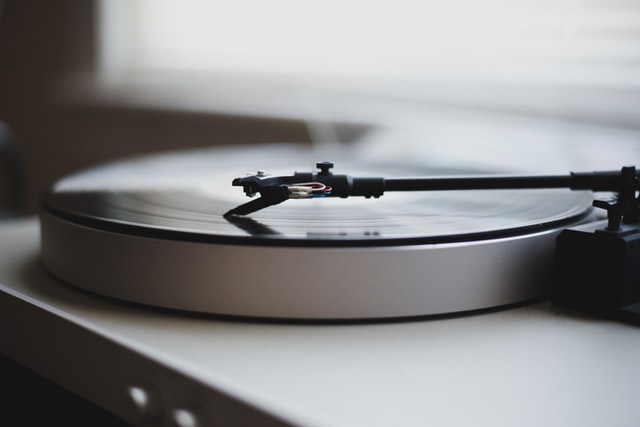 A photograph of a record player playing a record