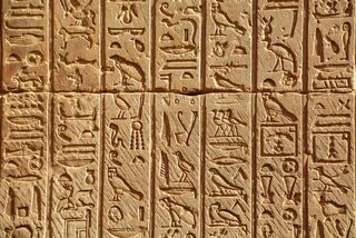 A photograph of hieroglyphs at the Temple of Hathor, Dendera