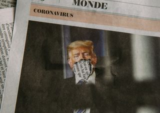 A photograph of a newspaper with Trump’s mouth torn out.