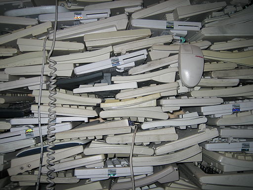 A photograph of many piles of many computer keyboards.