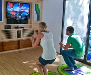 A man and a woman playing XBox Kinect game.