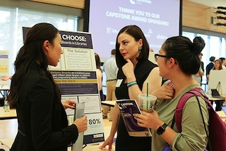 A photograph of students at the capstone fair.
