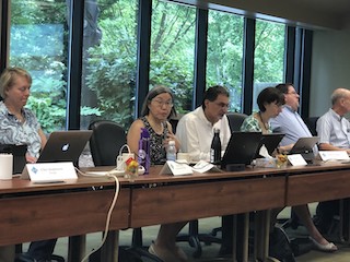 A photograph of Jane Prey leading a discussion.