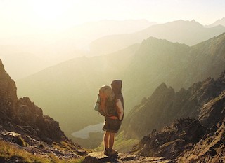 Stock photograph of someone exploring some mountains.