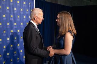 Joe Biden holding the hands of Sarah McBride.