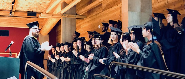 A photograph of the standing 2019 graduating class of the MHCI+D program