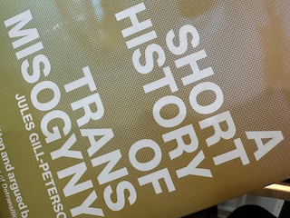 Photo of the cover of the book, reading "A SHORT HISTORY OF TRANS MISOGYNY" with an image of a dolled up woman behind.