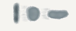 Three grey-blue blobs, one vertical, one circular in slight motion, and one oblong, racing to the future.