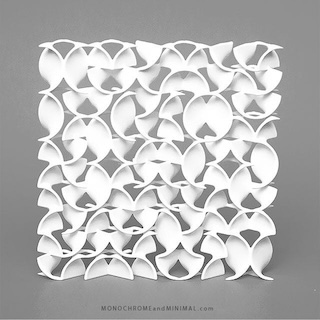 An organic petal-like pattern of three dimensional shapes.