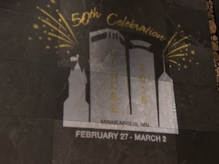 A photograph of SIGCSE 2019's projected logo on the hotel wall.