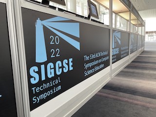 The SIGCSE 2022 registration booth.