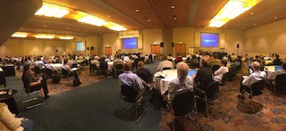 A panoramic shot of the Snowbird conference, showing the backs of many CS department chairs.