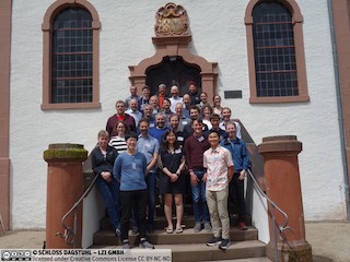 A group photo of the Dagstuhl castle of every attendee in the workshop on a staircase.