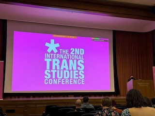 A bright pink slide reading the 2nd international trans studies conference