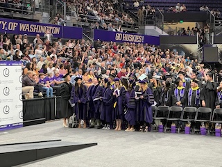 A stadium full of Information School graduates and proud families in the stands.