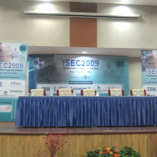 A photograph of a panelist table at ISEC 2009.