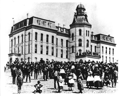 A photograph of students on the campus of Howard University, 1870