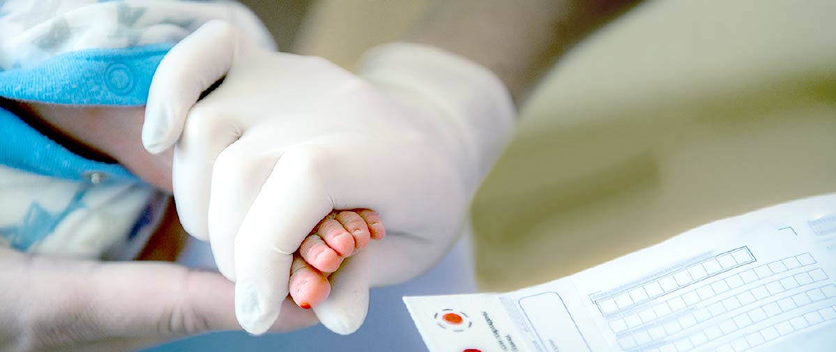 Newborn Dried Blood Spots Being Sampled by a PCP