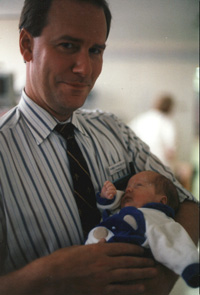 Tom with a baby ready to leave the NICU